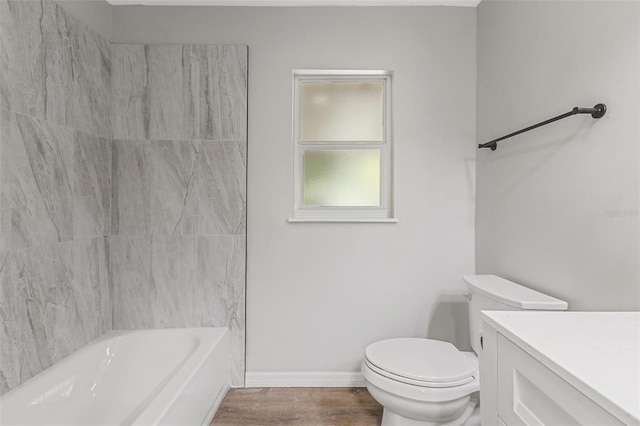 full bathroom with vanity, toilet, wood-type flooring, and shower / washtub combination