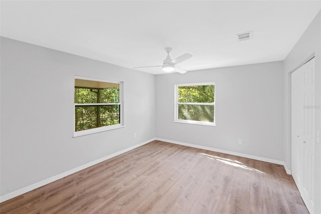 unfurnished room featuring ceiling fan and light wood-type flooring