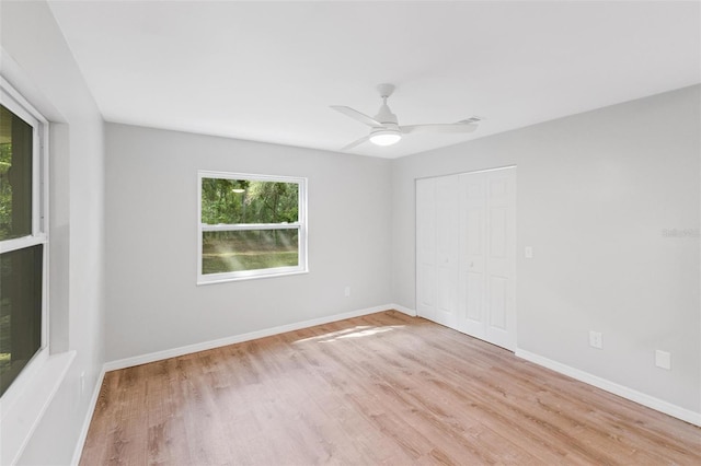 unfurnished room featuring ceiling fan and light hardwood / wood-style floors