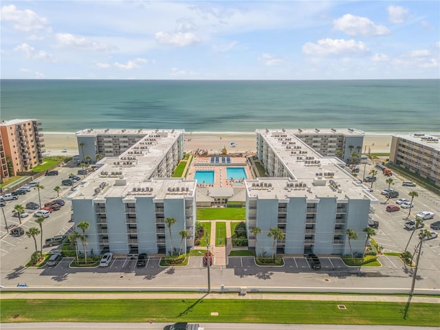 drone / aerial view featuring a water view and a city view