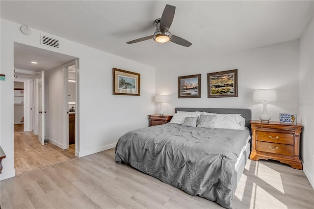 bedroom with a ceiling fan, baseboards, visible vents, and light wood finished floors