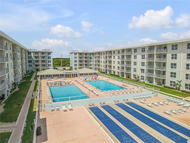 pool with shuffleboard and a gazebo