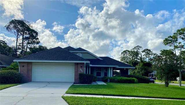 ranch-style home featuring a garage, concrete driveway, brick siding, and a front lawn