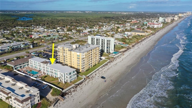 aerial view featuring a water view and a view of the beach