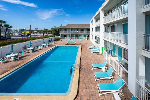 view of swimming pool with a patio area