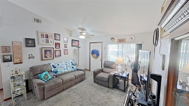 living room with lofted ceiling, light colored carpet, and ceiling fan