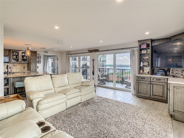 living room with light hardwood / wood-style flooring