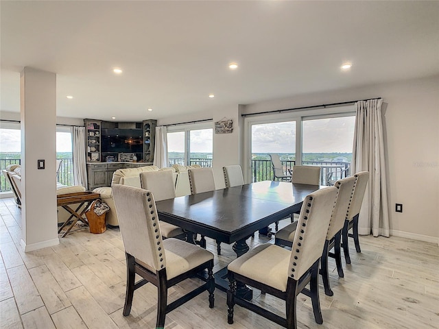 dining area with light hardwood / wood-style floors