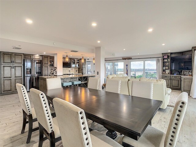 dining area with light hardwood / wood-style floors