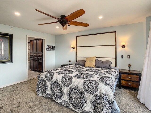 carpeted bedroom featuring a closet and ceiling fan