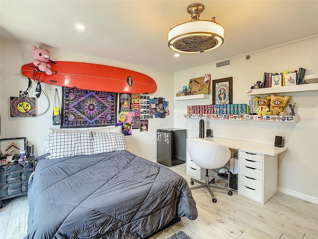 bedroom with light hardwood / wood-style floors