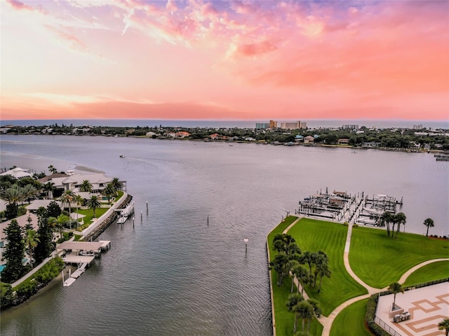 aerial view at dusk with a water view