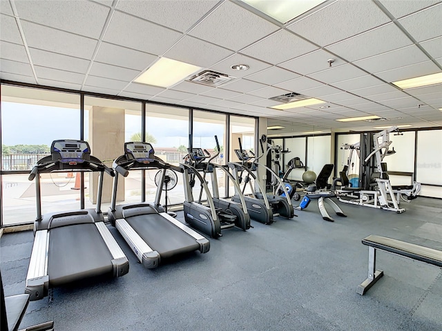 exercise room featuring a paneled ceiling