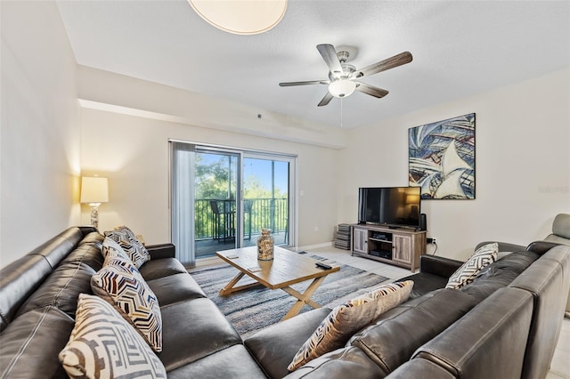 tiled living room with ceiling fan