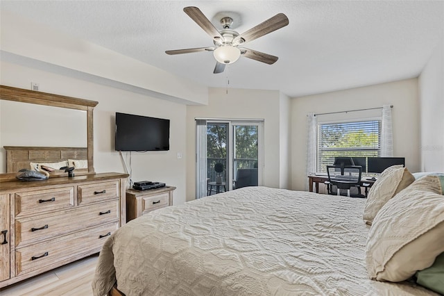 bedroom with ceiling fan, a textured ceiling, access to outside, and light hardwood / wood-style flooring