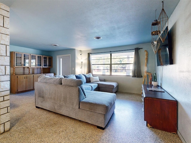 living room featuring a textured ceiling