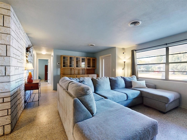 living room featuring a textured ceiling