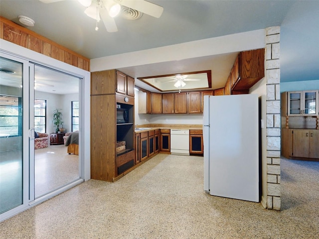 kitchen featuring white appliances and ceiling fan