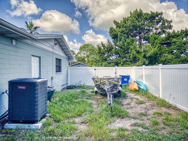 view of yard with central AC unit