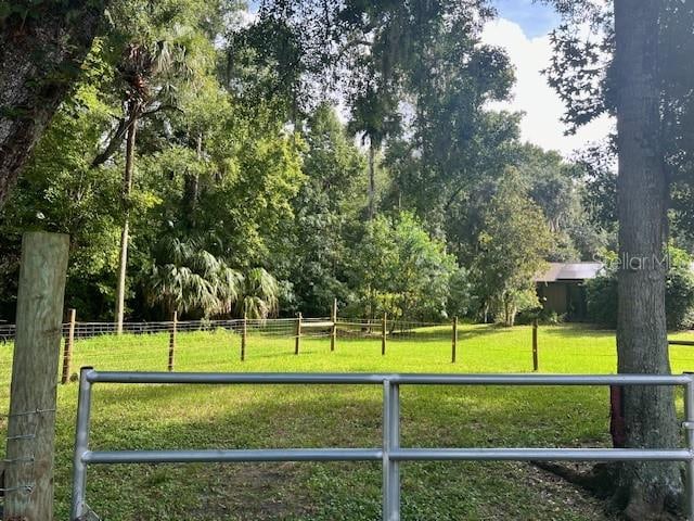 view of property's community featuring a lawn