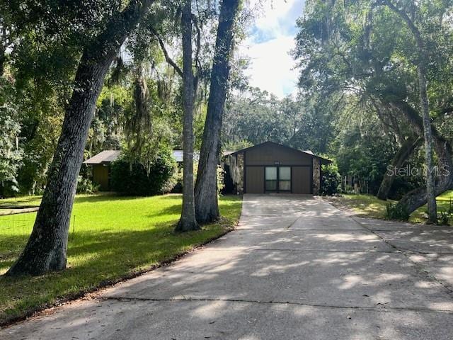 view of front facade with a garage and a front lawn