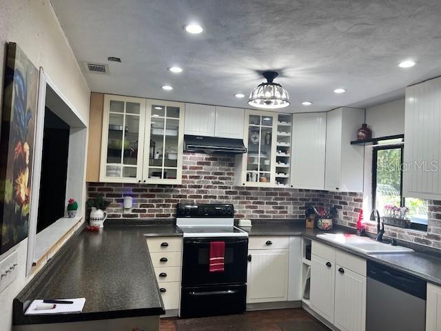 kitchen with dishwasher, white cabinetry, range with electric cooktop, and sink