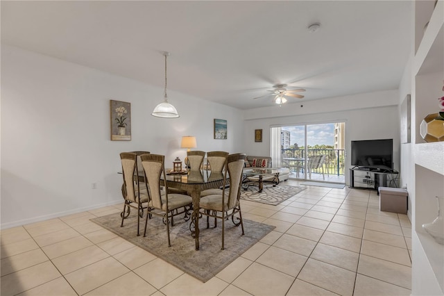 dining area with light tile patterned floors and ceiling fan