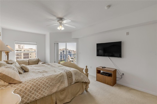 carpeted bedroom featuring ceiling fan and access to outside