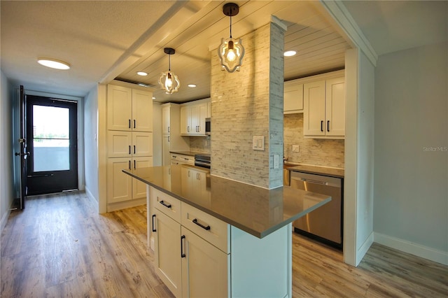 kitchen with stainless steel dishwasher, light hardwood / wood-style floors, white cabinetry, and a kitchen island