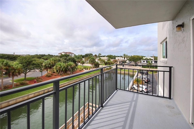 balcony featuring a water view