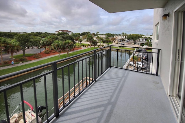 balcony featuring a water view