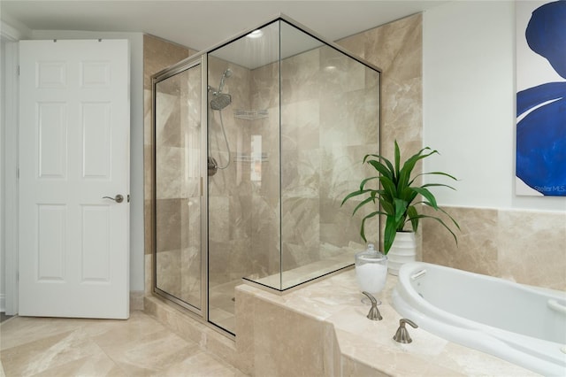 bathroom with independent shower and bath and tile patterned floors