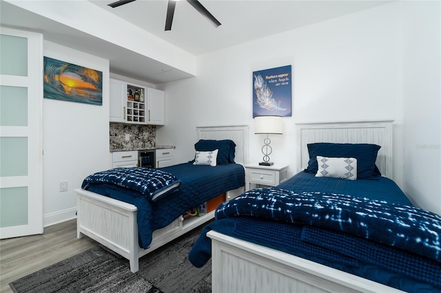 bedroom featuring ceiling fan and dark hardwood / wood-style flooring