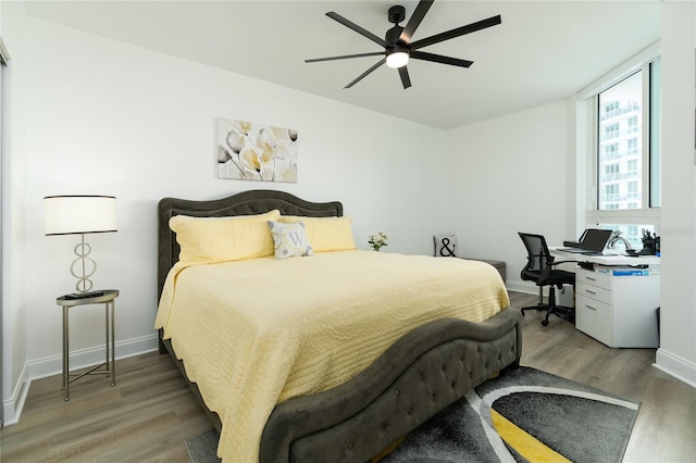 bedroom featuring ceiling fan and hardwood / wood-style flooring