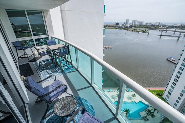 balcony featuring a water view