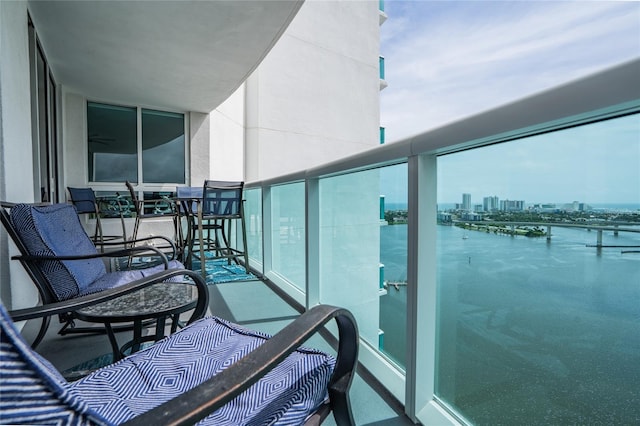 balcony featuring a water view