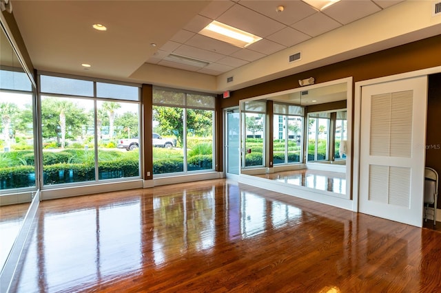 interior space featuring hardwood / wood-style flooring and expansive windows