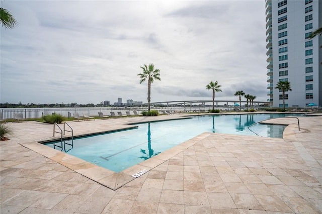 view of swimming pool with a patio area