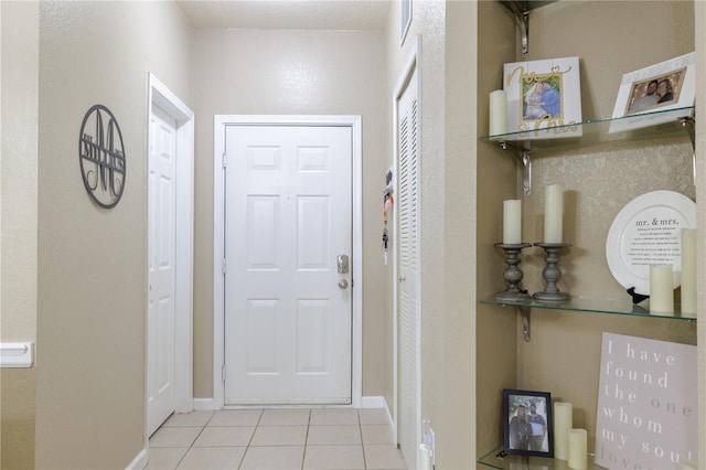 hallway featuring light tile patterned flooring