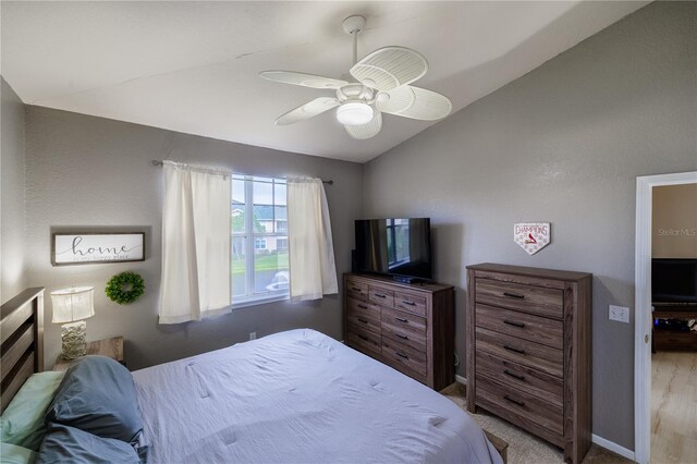 bedroom with vaulted ceiling and ceiling fan