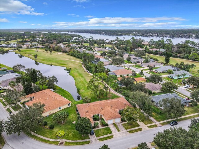 bird's eye view with a residential view and a water view