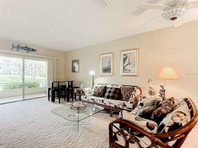 living room featuring light carpet and ceiling fan