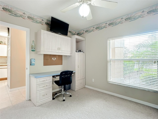 home office featuring ceiling fan and light carpet