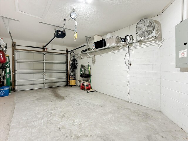 garage with electric panel and a garage door opener