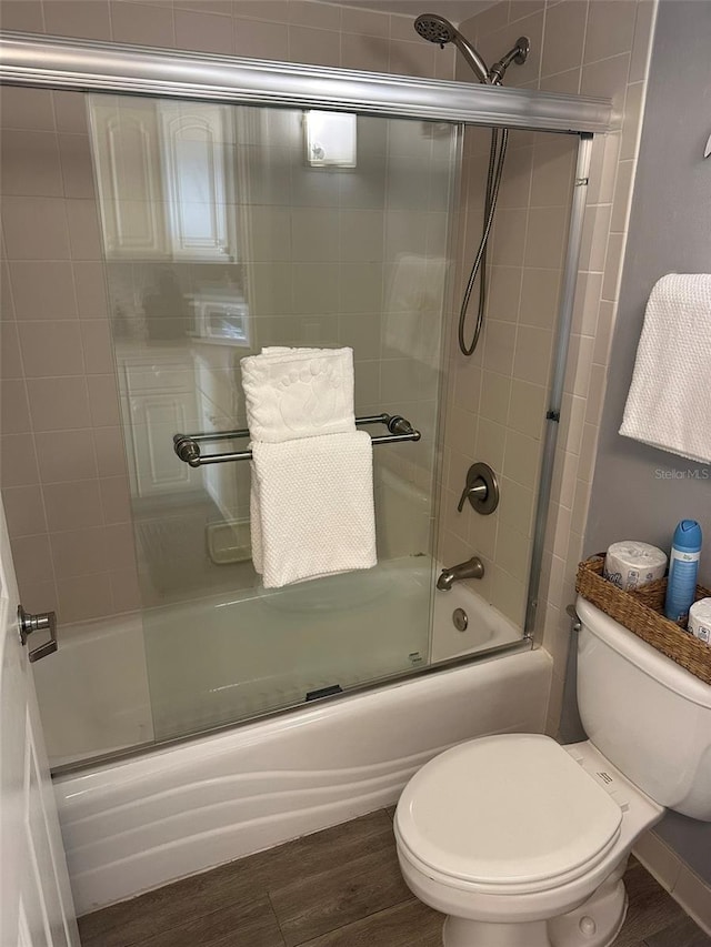 2700 N Atlantic Ave Unit 423, Daytona Beach, FL 32118 - bathroom featuring combined bath / shower with glass door and wood finished floors