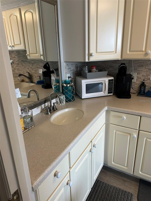 2700 N Atlantic Ave Unit 423, Daytona Beach, FL 32118 - bathroom with decorative backsplash, vanity, and tile patterned floors