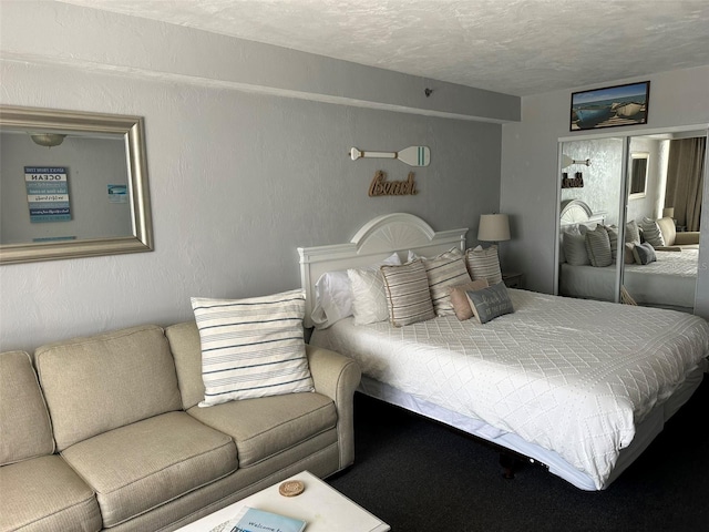 2700 N Atlantic Ave Unit 423, Daytona Beach, FL 32118 - bedroom featuring a textured ceiling and a closet