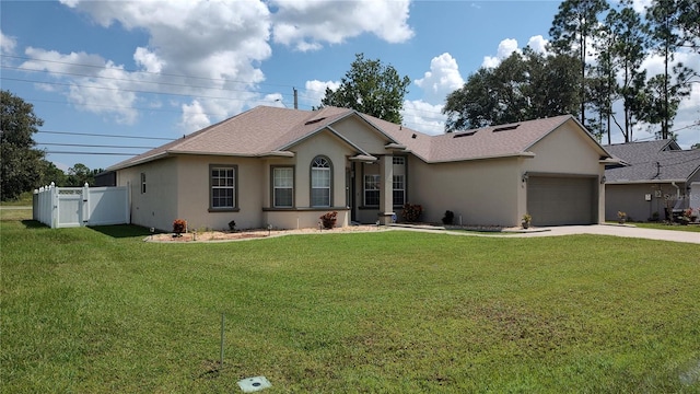 ranch-style home featuring a garage and a front yard