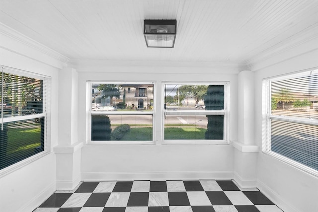 interior space featuring a wealth of natural light and crown molding