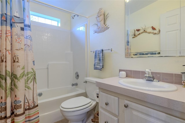 full bathroom with shower / tub combo, vanity, and toilet